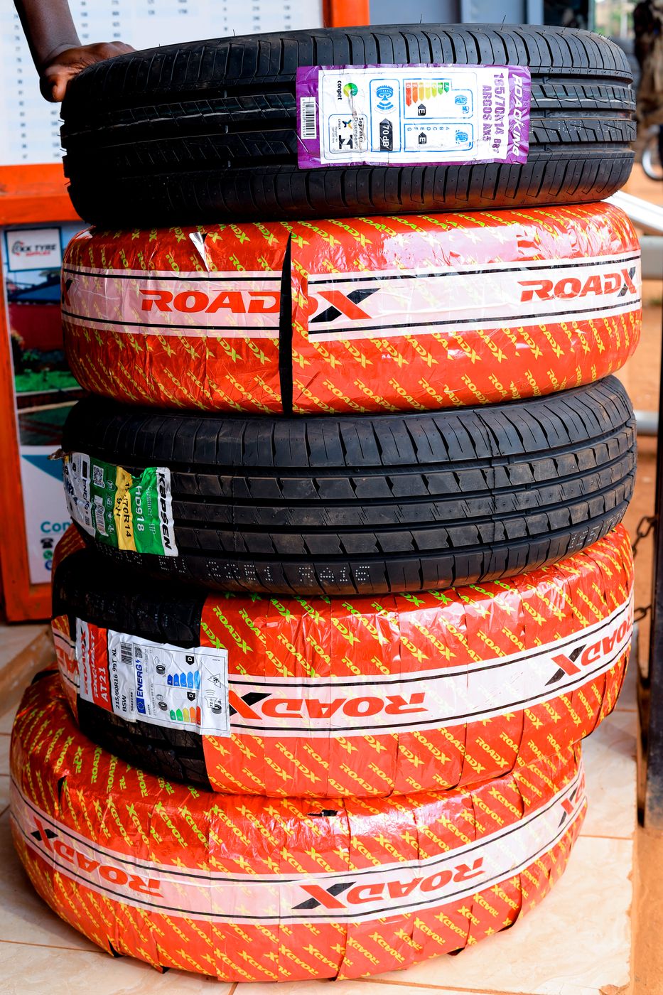 A stack of new RoadX, Kapsen and Roadking tyres